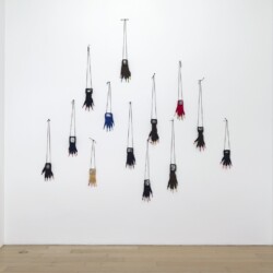 "Gants Grimaces", 1990, 13 gloves, wool, colour- pencils, 13 b&w photographs Variable dimensions