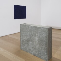 "Oltremare Verso Sud", 1967-2018, Yellow Lucerne granite, magnetic needle, glass, acrylic paint on wall Variable dimensions (Stone 70 x 80 x 16 cm, Oltremare 70 x 80 cm)