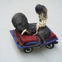 Mes Transports, 2012-13, Various objects, wood, metal, wheels, blankets, black wrap, 54 x 48 x 48 cm