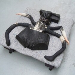 Mes Transports, 2012-13, Various objects, wood, metal, wheels, blankets, black wrap, 37 x 90 x 74 cm